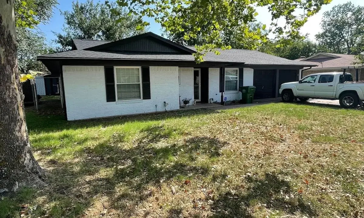 Professional roofing crew working on a residential roof in North Bend
